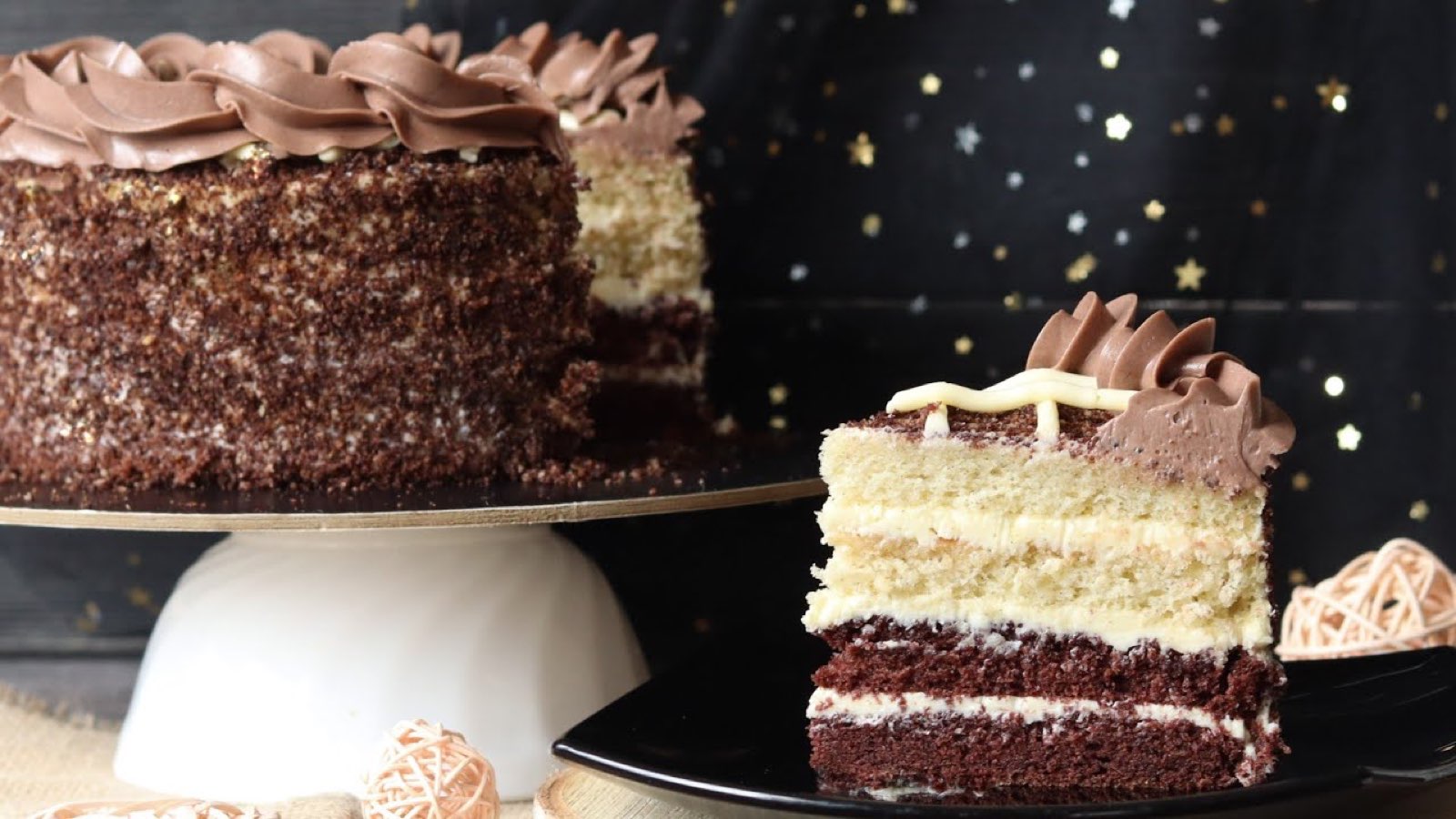 Golden Key chocolate layer cake with a slice cut